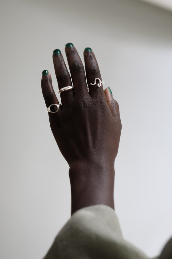 Model hand with multiple silver rings