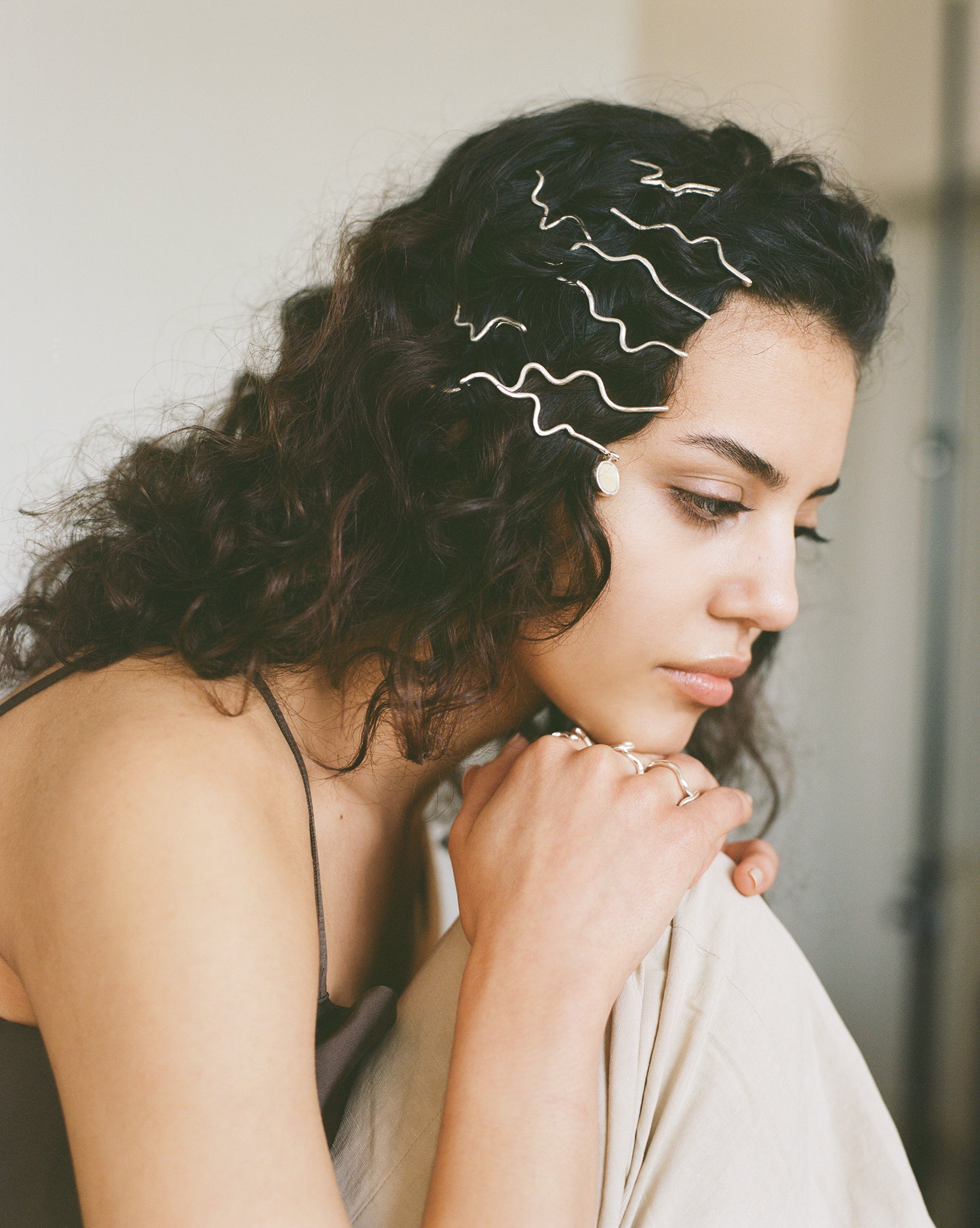 These statement recycled silver hair slides feature organic texture and a disc of ethically sourced highland horn, all ethically handmade in London by Folde Jewellery.