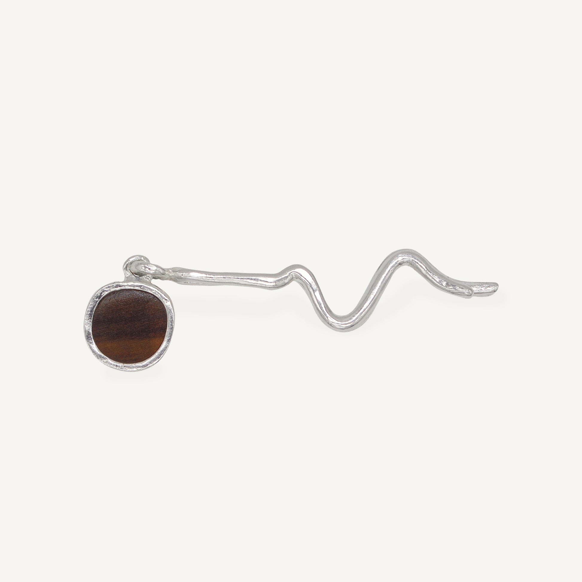 These statement recycled silver hair slides feature organic texture and a disc of ethically sourced highland horn, all ethically handmade in London by Folde Jewellery.