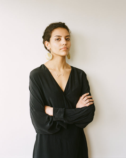 The IDA necklace is a sculptural elegant silver line necklace featuring organic texture ethically handmade in London from recycled silver by Folde Jewellery.