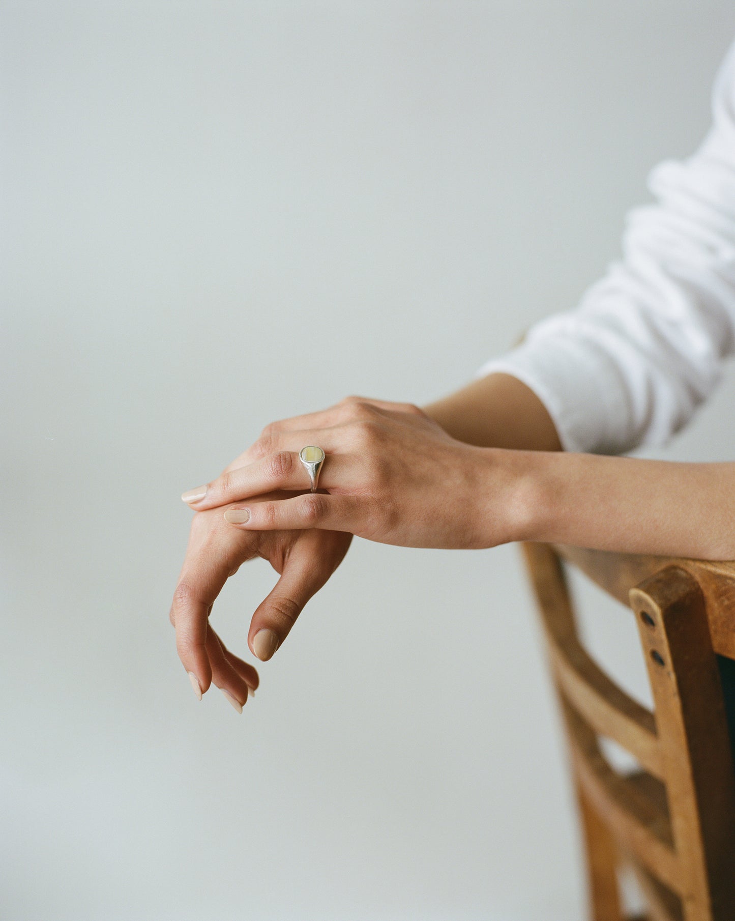 The RAY ring is a chunky silver and horn signet ring with organic textured silver finish ethically handmade in London from recycled silver by Folde Jewellery