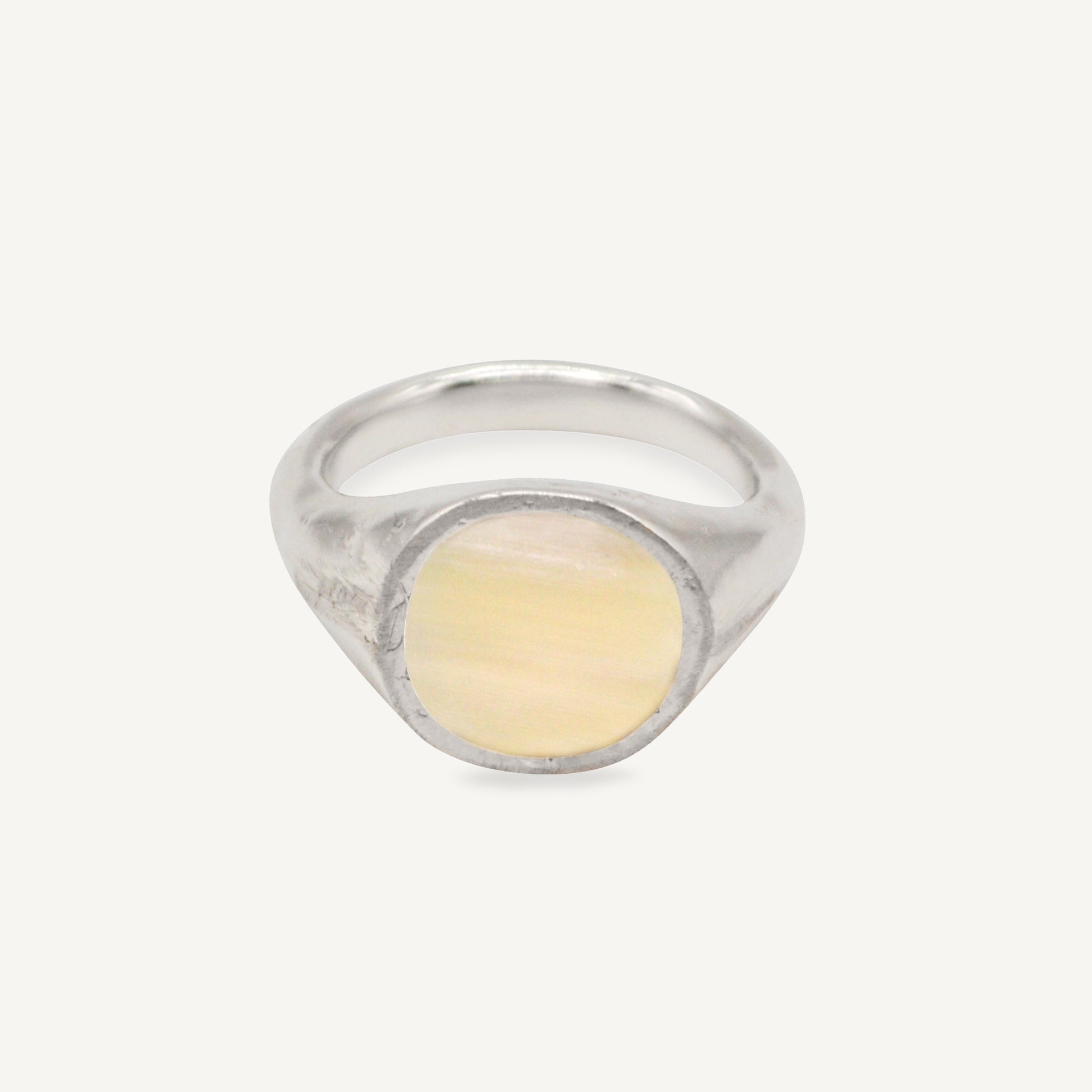The RAY ring is a chunky silver and horn signet ring with organic textured silver finish ethically handmade in London from recycled silver by Folde Jewellery