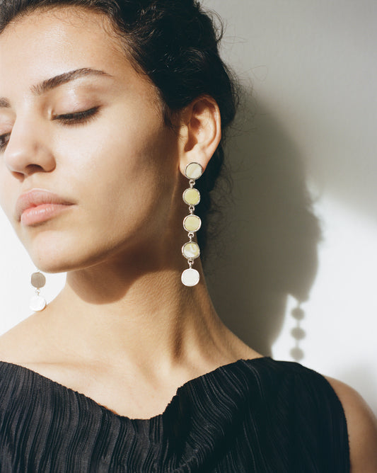 Sculptural statement silver drop earrings handcrafted by Folde Jewellery in London ethically handmade using recycled silver and highland horn.