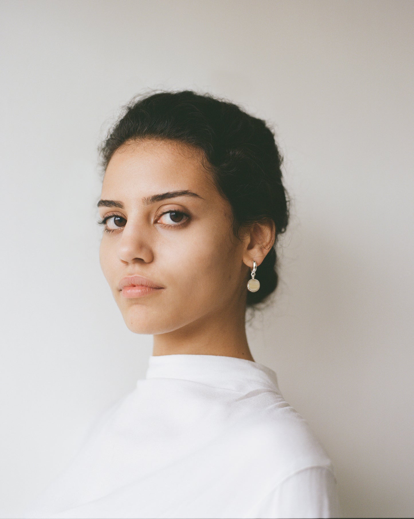 Sculptural statement silver hoop earrings handcrafted by Folde Jewellery in London ethically handmade using recycled silver and highland horn.