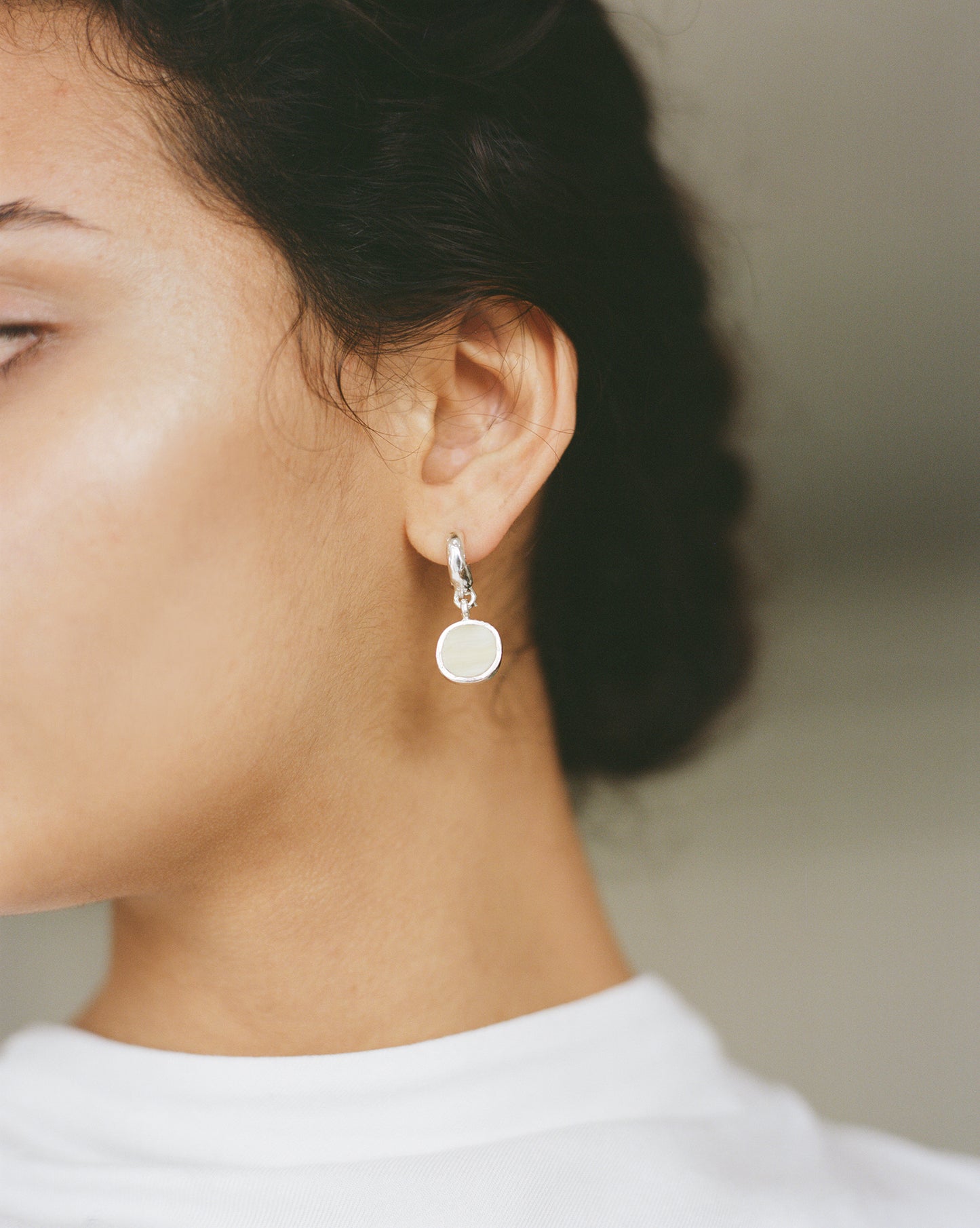 Sculptural statement silver hoop earrings handcrafted by Folde Jewellery in London ethically handmade using recycled silver and highland horn.