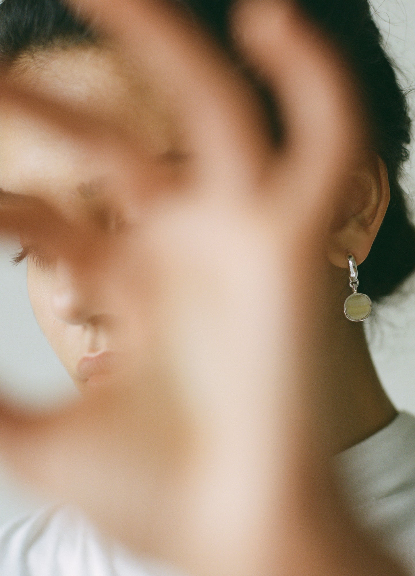 Sculptural statement silver hoop earrings handcrafted by Folde Jewellery in London ethically handmade using recycled silver and highland horn.