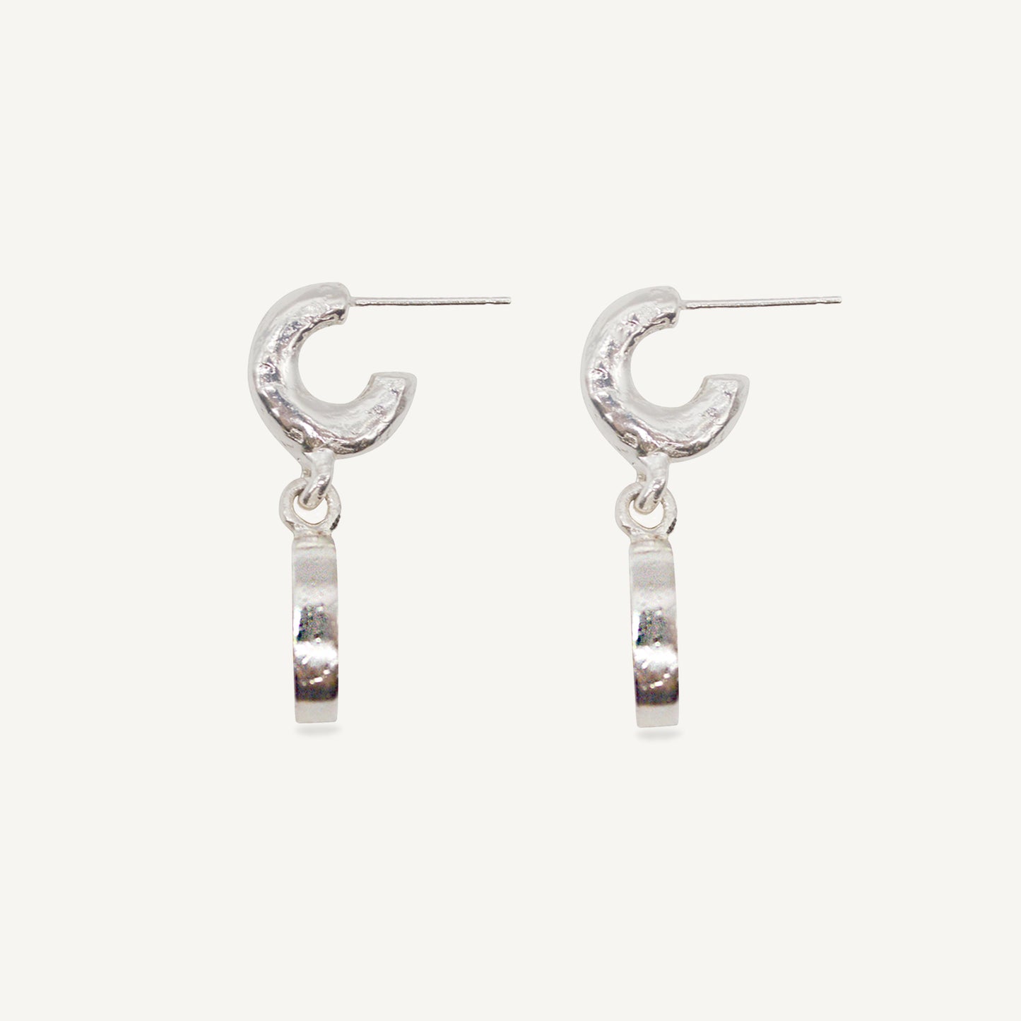 Sculptural statement silver hoop earrings handcrafted by Folde Jewellery in London ethically handmade using recycled silver and highland horn.